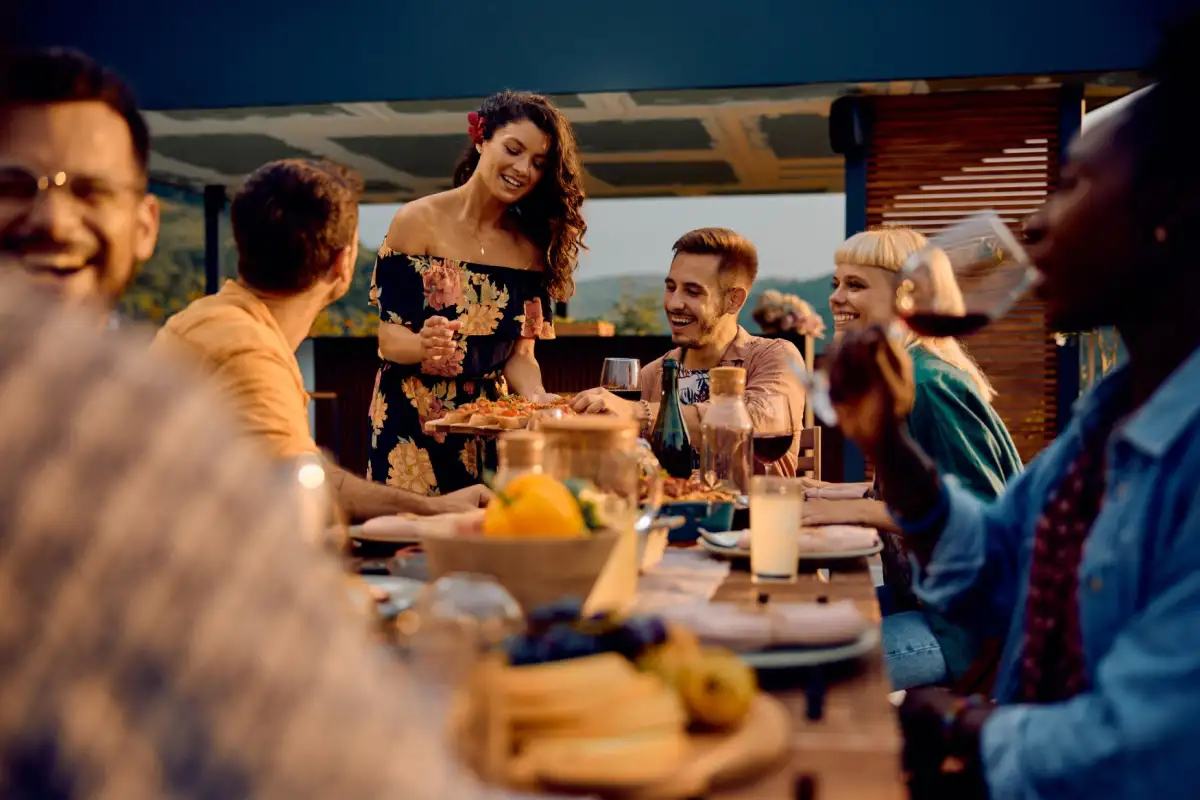 Elegant dinner setting on yacht deck during sunset, showcasing the ultimate private yacht experience with gourmet dining.
