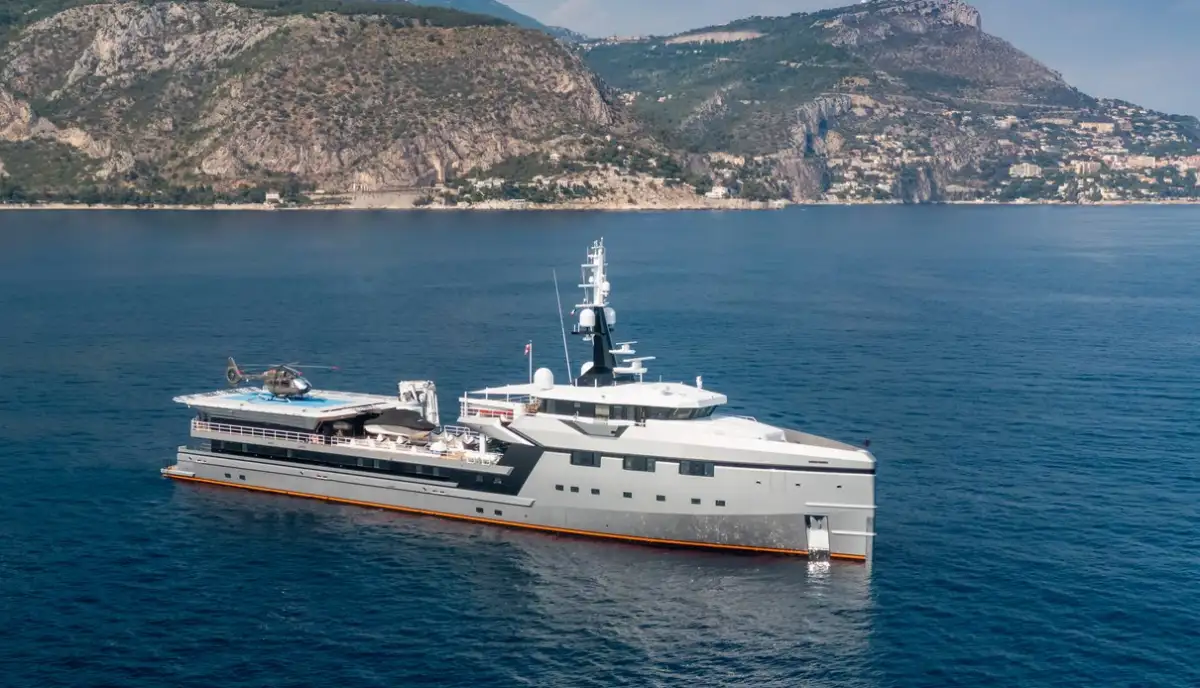 Abeona, the 75-meter support vessel for Jeff Bezos' Koru yacht, featuring helipad and luxury amenities in Mediterranean waters near Monaco