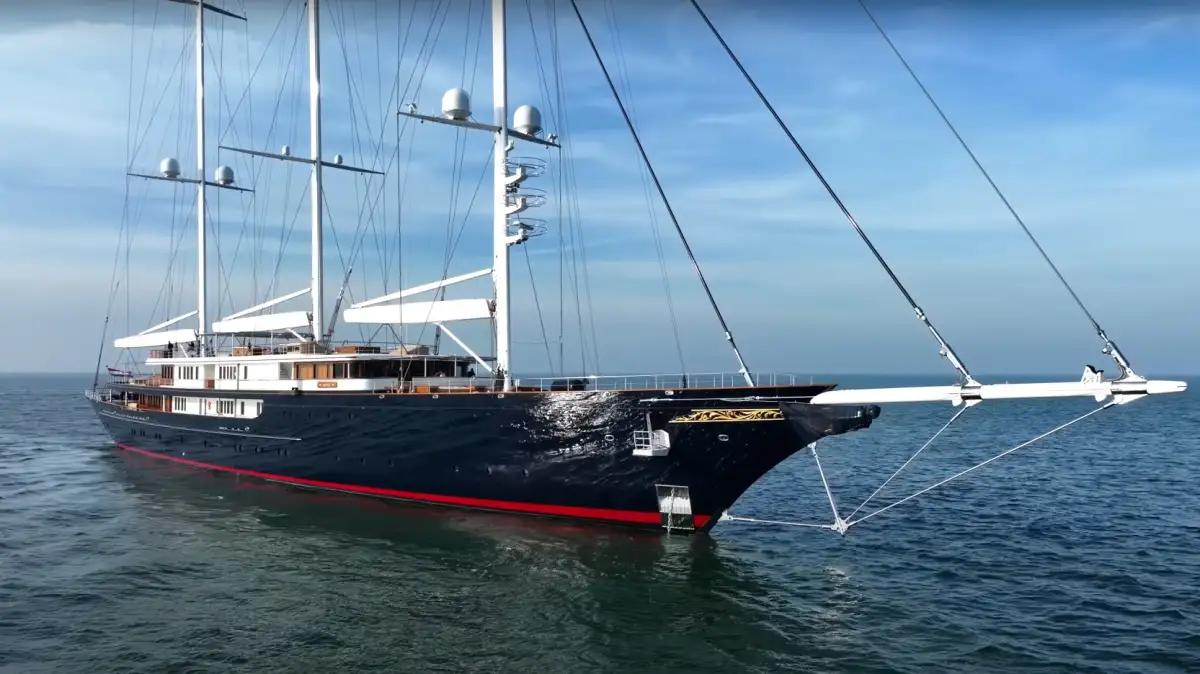 The $500 million Koru yacht anchored at sea, showcasing its three distinctive masts