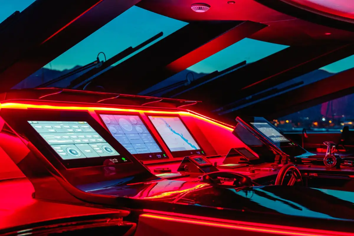 Advanced yacht bridge featuring integrated smart navigation systems with multiple touchscreen displays for real-time monitoring
