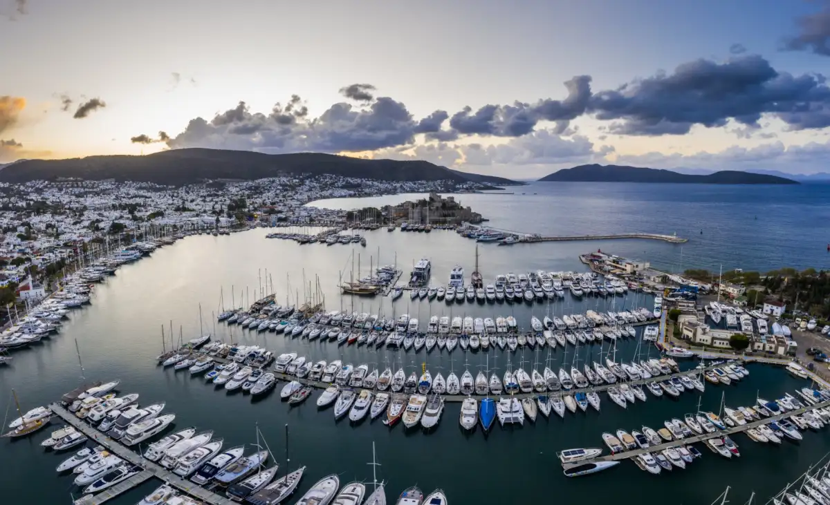 Bodrum marina with castle view showing luxury yacht charter facilities and ancient ruins