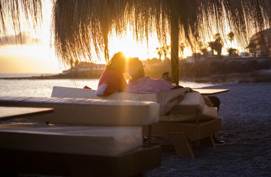 A couple enjoying the sunset in Mykonos